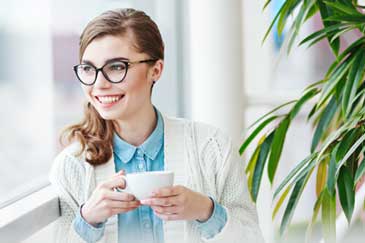 Smiling young woman wearing glasses from the optical boutique
