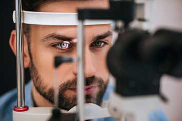 Man getting his retina examined