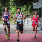 Three people running in a race